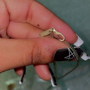 It’s a Kors set with a gold plated chain